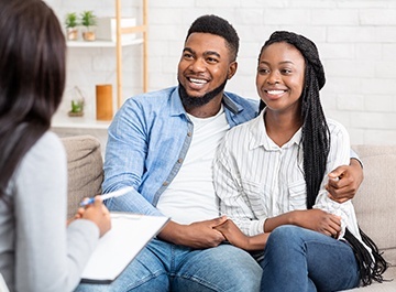 Therapist Services for Support Healing and Growth An image illustrating a couples therapy session, with a therapist mediating a discussion between a couple seated in a comfortable counseling room