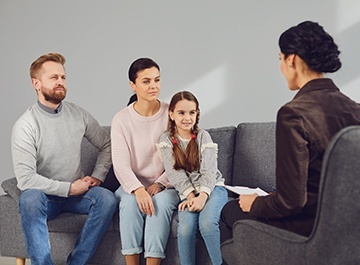 Therapist Services for Support Healing and Growth An image depicting a family engaged in a therapy session, with a therapist facilitating the discussion in a comfortable and welcoming counseling room