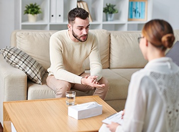 Therapist Services for Support Healing and Growth An image portraying an individual therapy session, with a therapist and a client engaged in conversation within a comfortable and private office setting.